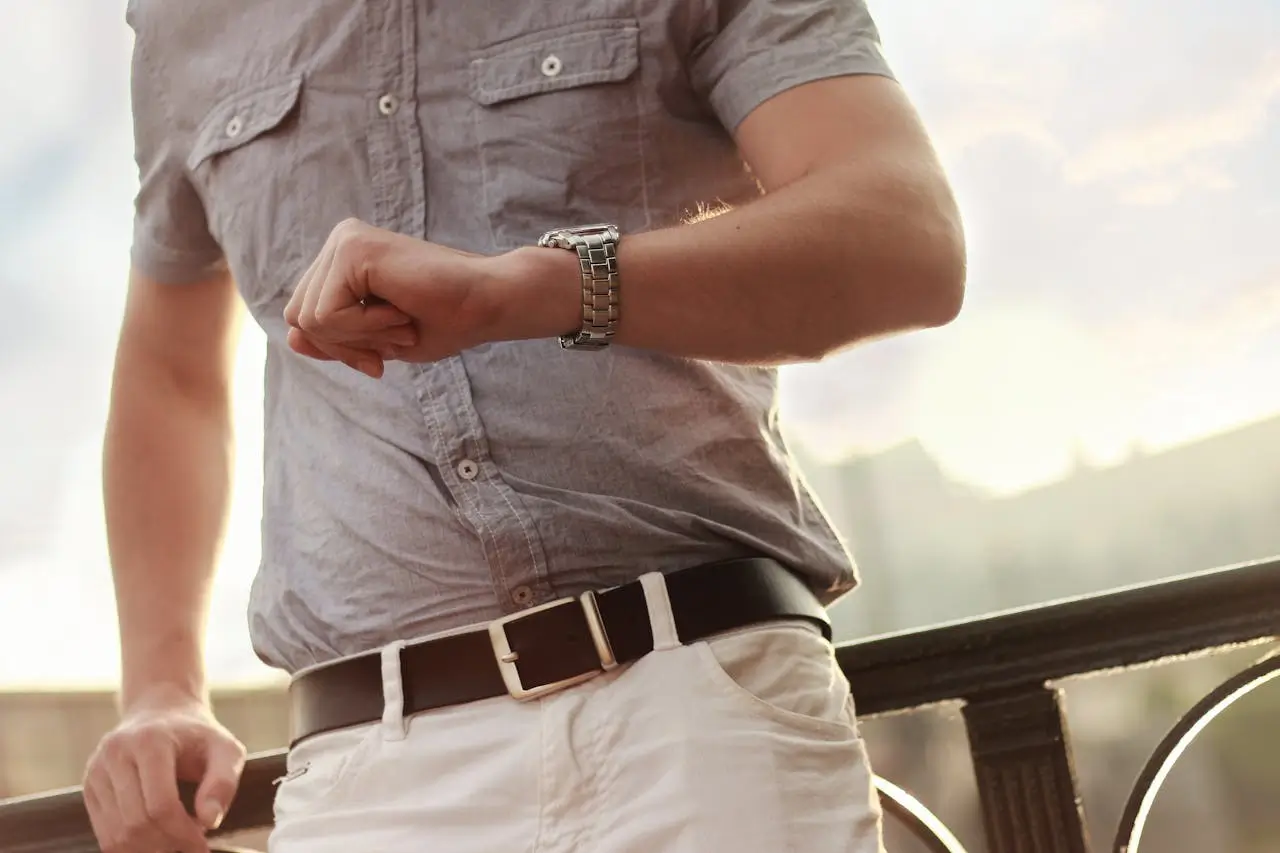 Man looking at his watch waiting.